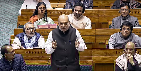 Union Home Minister Amit Shah speaks in the Lok Sabha during the Winter session of Parliament, in New Delhi, Tuesday, Dec. 17