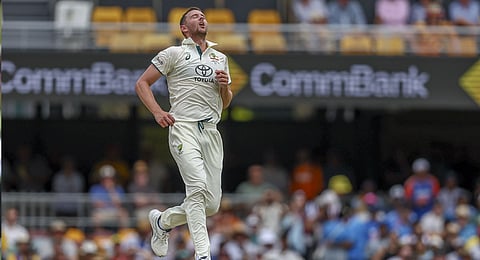 Australia's Josh Hazlewood reacts after bowling a delivery during play on day three of the third cricket test between India and Australia at the Gabba in Brisbane, Australia, Monday, Dec. 16, 2024. 