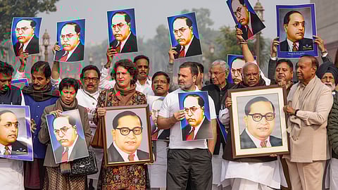 Several MPs of the INDIA bloc staged a protest in Parliament premises on Wednesday demanding Home Minister Amit Shah's apology for his remarks which they claimed were an insult to B R Ambedkar. 