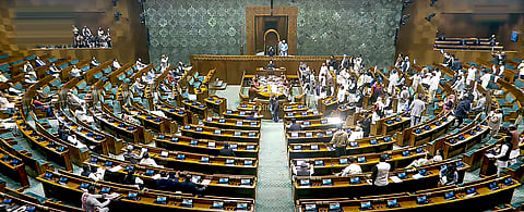 Opposition members protest in the Lok Sabha during the Winter session of Parliament, in New Delhi, Wednesday, Dec. 18, 2024.