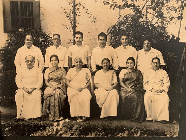Thomas Burleigh Kurishingal (third from the right in the second row) in this family photo.