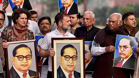 Members of the Opposition INDIA bloc, including Congress leaders (L to R) Priyanka Gandhi, Rahul Gandhi, and Malllikarjun Kharge, hold a protest against Union Home Minister Amit Shah at the Parliament premises in New Delhi on Wednesday, Dec. 18, 2024.