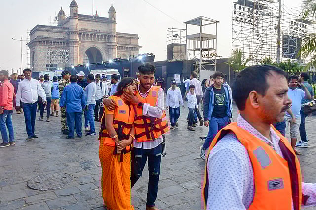  Passengers after being rescued in a joint operation by the Indian Navy and Indian Coast Guard after a ferry capsized off Mumbai coast, Wednesday