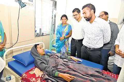 Collector B Satya Prasad interacts with students of Peddur Gurukul residential school at government area hospital in Korutla town of Jagtial district on Thursday