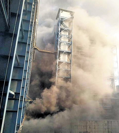 Dust billowing out as the coal bunker collapses