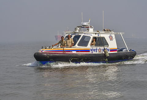 Security personnel during a search operation for missing passengers a day after a ferry-Navy craft collision claimed 13 lives off Mumbai.