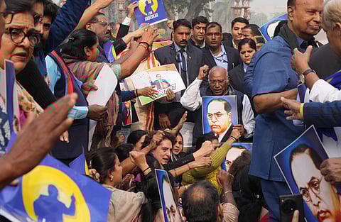 LoP in the Rajya Sabha and Congress President Mallikarjun Kharge with party MP Priyanka Gandhi Vadra and DMK MP Kanimozhi Karunanidhi during a protest by the INDIA bloc members in Parliament premises 