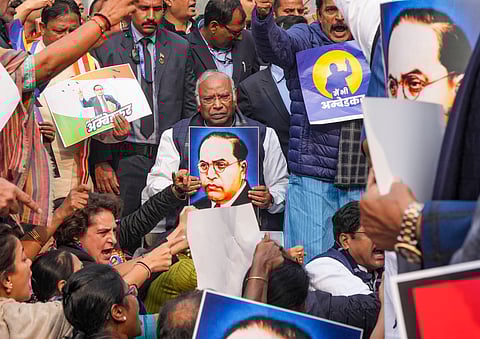 INDIA Bloc MPs take part in a protest march demanding an apology and resignation of Union Home Minister over his remarks on Ambedkar, at Parliament complex.