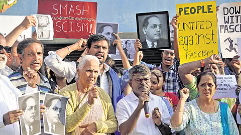 Members of Dalit Vidyarthi Parishat, Bangalore University Research Scholars’ Association, and other groups stage a protest against Union Home Minister Amit Shah’s remarks against Babasaheb Ambedkar at Freedom Park in Bengaluru