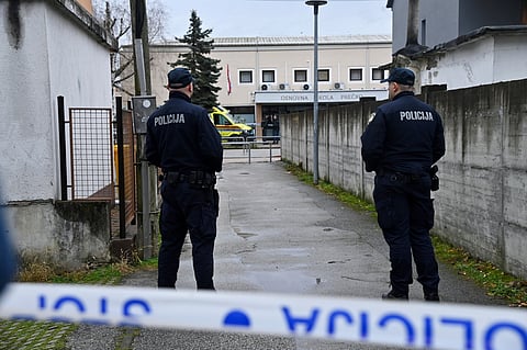 Police secure access to the elementary school where a 7-year-old girl died and a teacher and five other students were wounded in a knife attack in Zagreb, Croatia, Friday, Dec. 20, 2024.