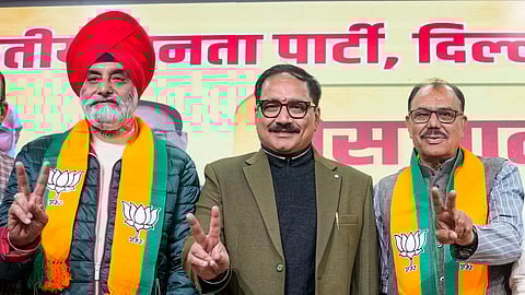 Delhi BJP chief Virendra Sachdeva (L) with ex-AAP leader Sukhveer Singh Dalal 