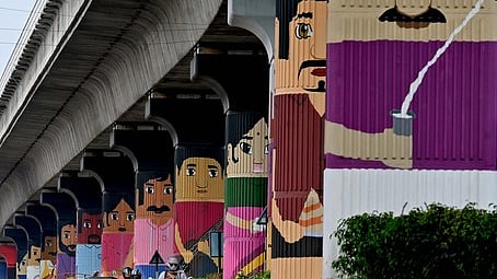 The mega paintings of Channapatna toys on the pillars of the yellow line of Namma Metro at Huskur 