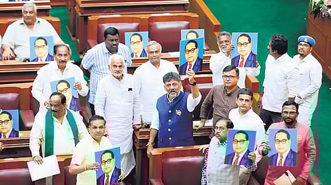 Congress MLAs display portraits of Dr BR Ambedkar during the session in Suvarna Vidhana Soudha in Belagavi.