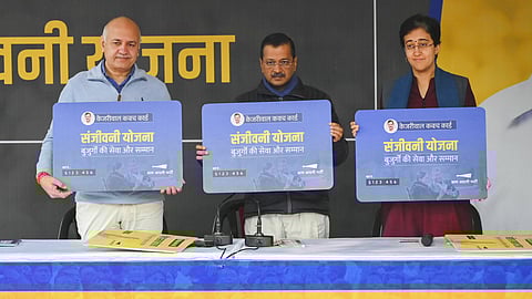 Delhi Chief Minister Atishi with AAP National Convener Arvind Kejriwal and party leader Manish Sisodia during a press conference regarding the launch of 'Sanjeevani Yojana', in New Delhi, Sunday, Dec. 22, 2024.