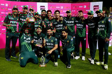 Pakistan's players pose with the trophy following the third International cricket match between South Africa and Pakistan, at the Wanderers stadium in Johannesburg, South Africa, Sunday, Dec. 22, 2024. 