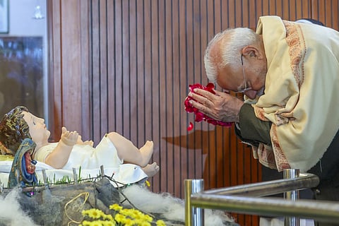 Prime Minister Narendra Modi offers prayers during Christmas celebrations hosted by the Catholic Bishops' Conference of India, in New Delhi, Monday, Dec. 23, 2024. 