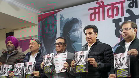 AICC treasurer Ajay Maken and Delhi Congress President Devender Yadav release a booklet against the BJP and AAP titled 'Mauka Mauka Har Baar Dhokha', in New Delhi, Wednesday, Dec. 25, 2024.