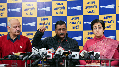 AAP National Convenor Arvind Kejriwal (C) addresses a press conference in the presence of Delhi Chief Minister Atishi and party leader Manish Sisodia in New Delhi on Wednesday, Dec. 25, 2024.