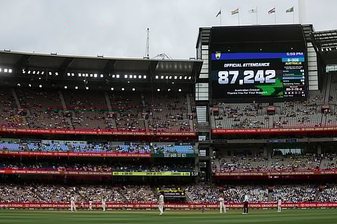 The official attendance figure is displayed on the scoreboard on the first day of the fourth cricket Test match between Australia and India at the Melbourne Cricket Ground (MCG) in Melbourne on December 26, 2024.