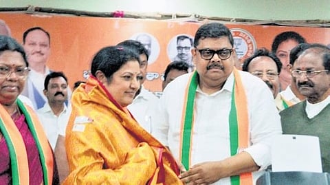 Adari Anand Kumar joined the BJP on Wednesday in the presence of party State chief D Purandeswari.