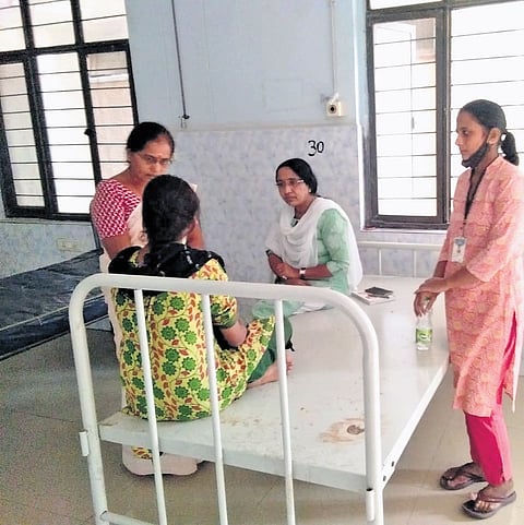 A woman receives counselling from members of the Karimnagar Sakhi One Stop Centre (OSC)