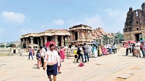 Tourists on the premises of Vijaya Vittala Temple in Hampi, a UNESCO World Heritage site, in Vijayanagara district. Hampi received a large number of tourists in December this year.