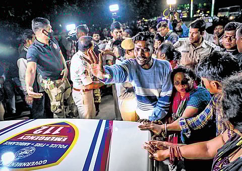 Locals trying to stop the PCR van carrying the driver who caused a series of accidents near Xavier Square, in Bhubaneswar on Saturday 