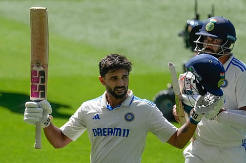 India's Nitish Kumar Reddy acknowledged the crowd as he walked off the field after losing his wicket during play on day four of the fourth cricket test between Australia and India at the Melbourne Cricket Ground.