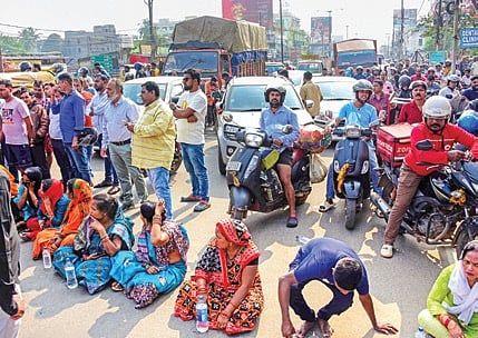 Locals staging road blockade at Laxmisagar Square on Sunday afternoon 