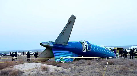 In this photo taken from a video released by the administration of the Mangystau region, a part of Azerbaijan Airlines' Embraer 190 lies on the ground near the airport of Aktau, Kazakhstan, on Thursday, Dec. 26, 2024. 
