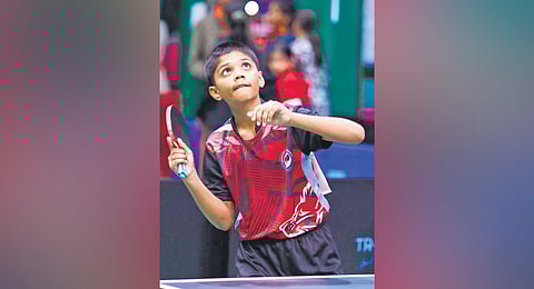 Ten-year-old Kotagiri Hitesh Sriranga from Tallada village in Khammam district plays a shot during a table tennis match at the Jimmy George Sports Hub in Thiruvananthapuram, Kerala