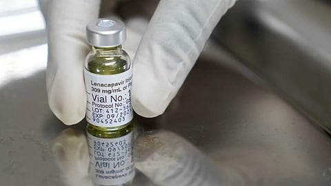 A pharmacist holds a vial of lenacapavir, the new HIV prevention injectable drug.