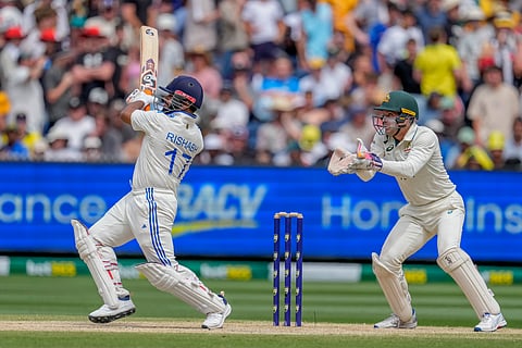 Rishabh Pant plays a shot in the air before being caught by Mitchell Marsh during play on the last day of the fourth Test between Australia and India (Photo | AP)