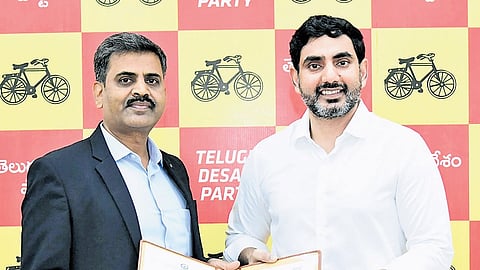 TDP general secretary and HRD Minister Nara Lokesh exchange a copy of the MoU  with representatives of insurance companies on Thursday