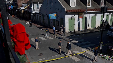 Members of the FBI walk around Bourbon Street during the investigation of a truck fatally crashing into pedestrians on Bourbon Street in the French Quarter in New Orleans.