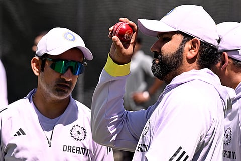 Indian coach Gautam Gambhir (L) and captain Rohit Sharma (R) chat in the nets at the Melbourne Cricket Ground (MCG) in Melbourne.