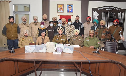 Punjab Police with the accused and the seized items from them.