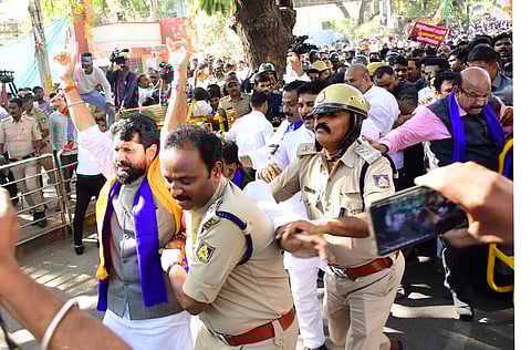 BJP leader and senior minister C T. Ravi being taken into custody by police in Kalaburagi on Saturday 