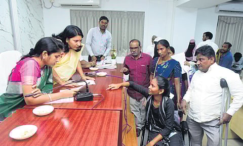 District Collector Valluru Kranthi receives an application from a disabled person at the Sangareddy collectorate on Saturday