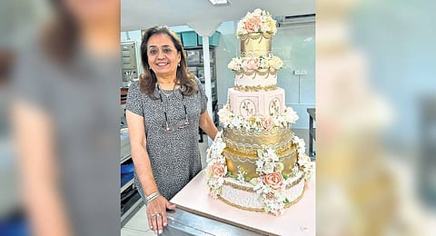 Bunty Mahajan with the Nita and Mukesh Ambani anniversary cake
