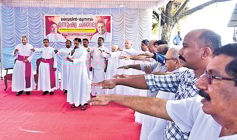 Archbishop Joseph Kalathiparambil (extreme left) sets off the human chain expressing solidarity with Munambam residents in the land dispute 