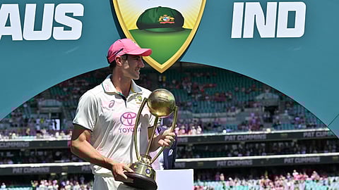 Australia’s captain Pat Cummins holds The Border-Gavaskar Trophy after winning the fifth cricket Test match and series between Australia and India at the Sydney Cricket Ground on January 5, 2025.