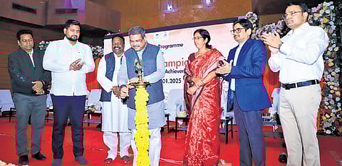 Pradhan lighting the lamp during the 58th Foundation Day of Sambalpur University