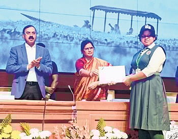 Parida felicitating a student at the Chilika Bird Festival on Monday