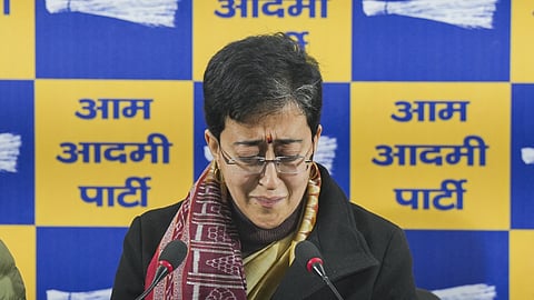 Delhi Chief Minister Atishi reacts emotionally during a press conference, over BJP leader Ramesh Bidhuri's remarks against her, in New Delhi, Monday, Jan. 6, 2025.