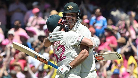Australia’s Travis Head and Beau Webster (R) celebrate victory against India in the fifth and final cricket Test match at the Sydney Cricket Ground on January 5, 2025.