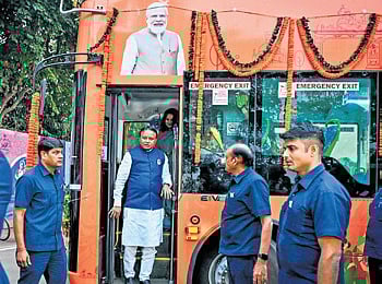 CM Majhi standing at the door of a double-decker bus after its launch 
on Tuesday | DEBADATTA MALLICK 