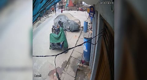 Residents try to use mobile phone to call their missing relatives as they search for survivors amonst the rubble of a collapsed building in Dujiangyan.