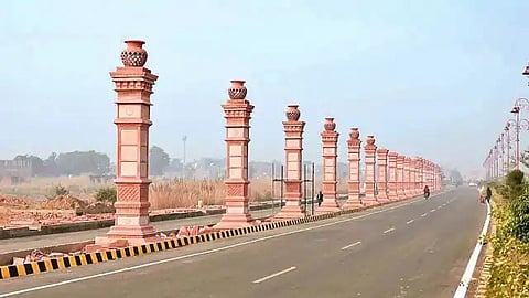 The newly-constructed 84 red sandstone pillars on the approach road to Prayagraj.