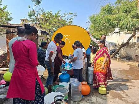 Water being supplied through a tanker to residents of Hyderabad